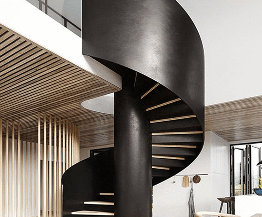 Escada metálica helicoidal com design exclusivo em ambiente sofisticado - a arte em aço da HBFER Estruturas Metálicas