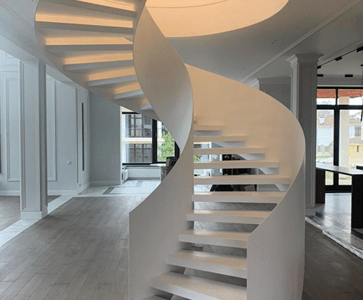 Escada metálica helicoidal com design exclusivo em ambiente sofisticado - a arte em aço da HBFER Estruturas Metálicas